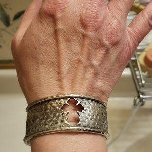 Silver bracelet with embedded cross